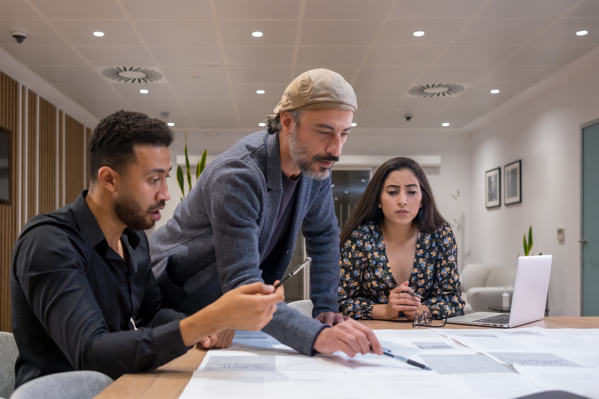 Project manager working with employees in a coworking